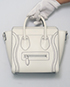 Debossed Nano Luggage Bag, front view